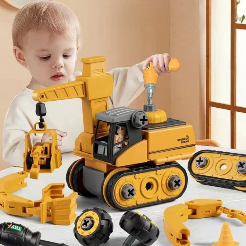 un-jeune-garçon-joue-avec-un-tracteur-et-une-visseuse