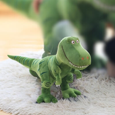 tyrannosaure-vert-de-40cm-souriant-sur-un-tapis