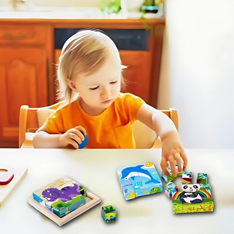 enfant-3-ans-fait-puzzle-chandail-orange