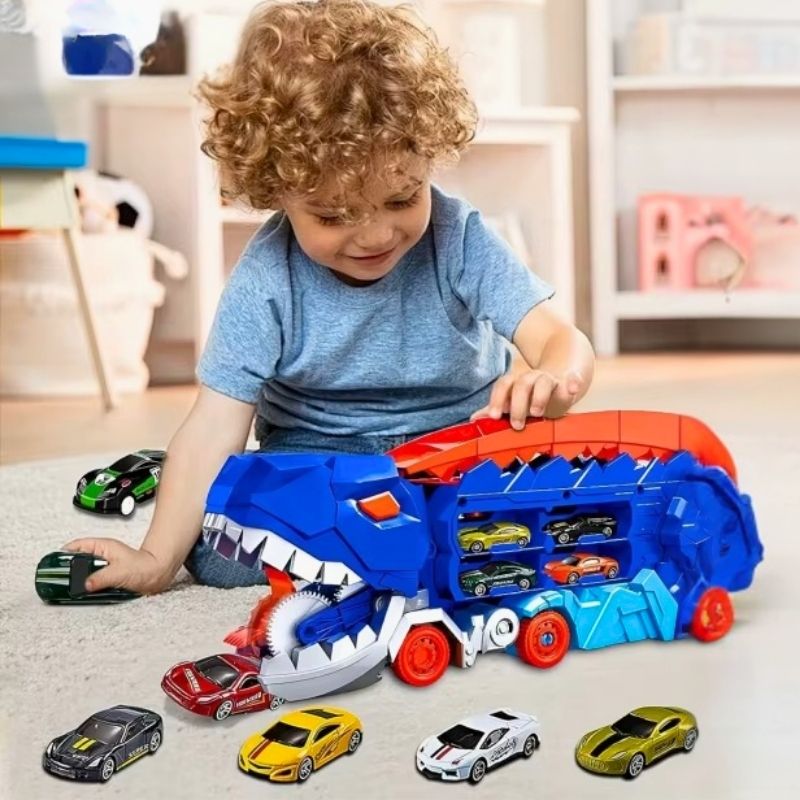 camion jouet un petit garçon s'amuse beaucoup avec son camion dinosaure