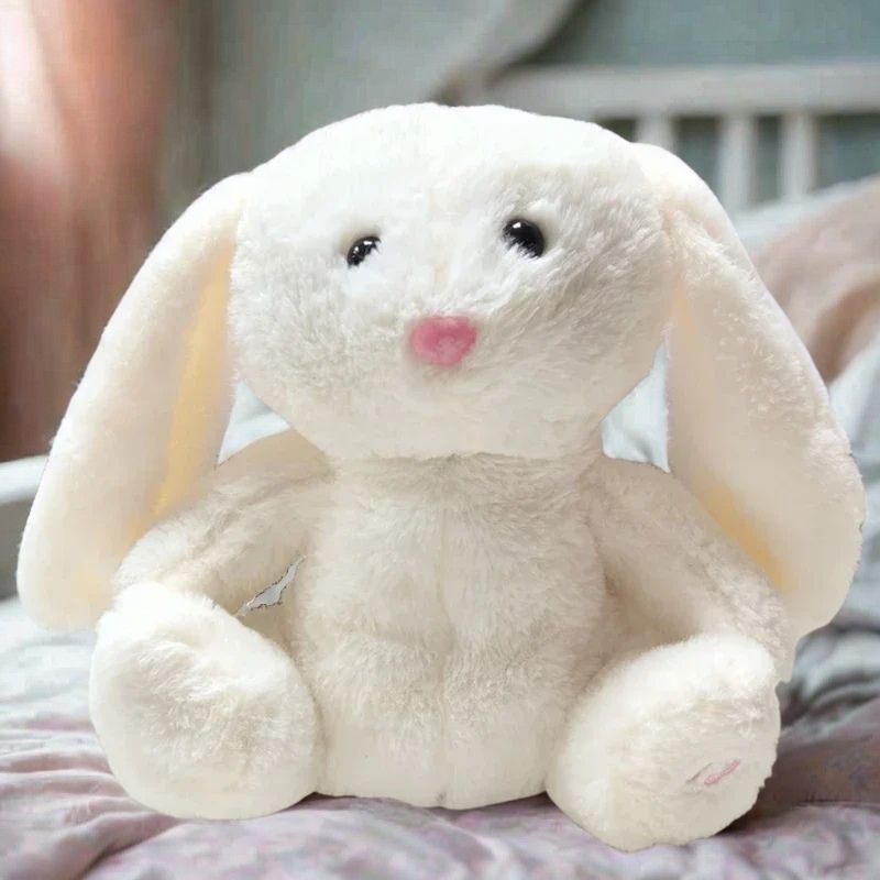 doudou lapin qui respire sur lit de bebe