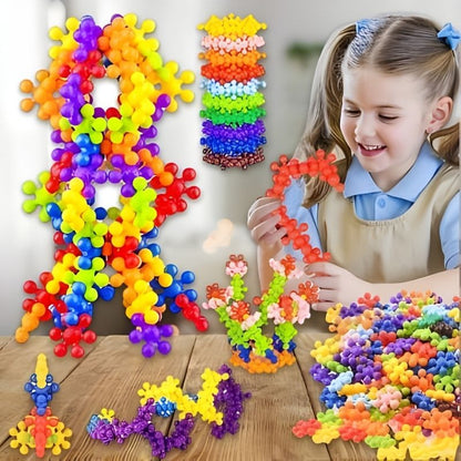 fillette joyeuse et fière de ses créations jeu de construction