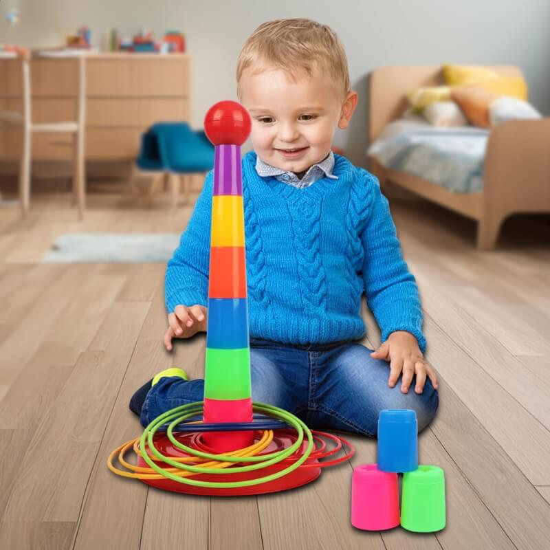 un-enfant-a-genoux-dans-sa-chambre-devant-sa-tour-de-gobelets-avec-ses-anneaux-colorea-en-plastique