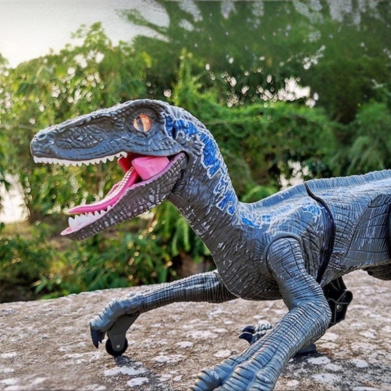 jouet dinosaure bleu réaliste lumière intégré roulette pattes coussinées