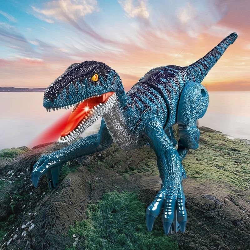jouet dinosaure vélociraptor bleu dans l'herbe