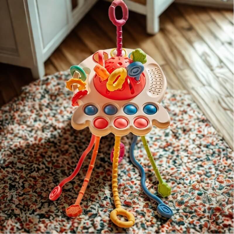 un-jouet-poulpe-pour-bébé-sur-une-carpette-colorée