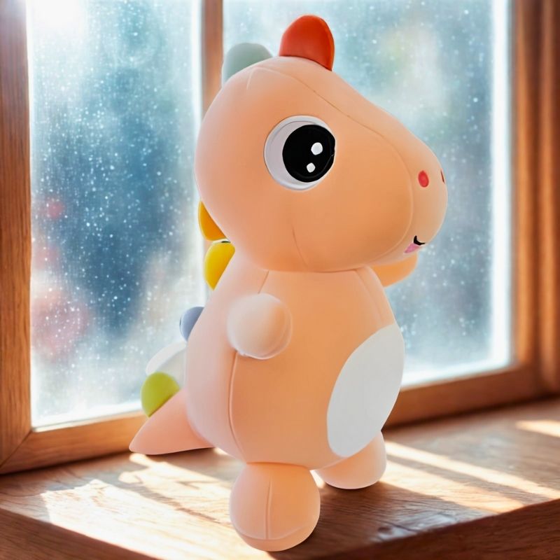 peluche dinosaure mignon bébé dinosaure orange bord de fenêtre
